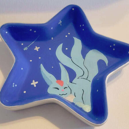 A handpainted tray featuring a carbuncle from Final Fantasy.