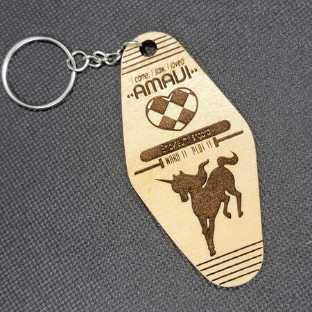 A wooden hotel keyfob-inspired keychain, designed for a Final Fantasy 14 player's guild