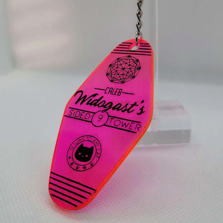 Caleb Widogast's Nine-Sided Tower Keyfob A hot pink acrylic keyfob that was made as a mock-up. Design inspired by Critical Role